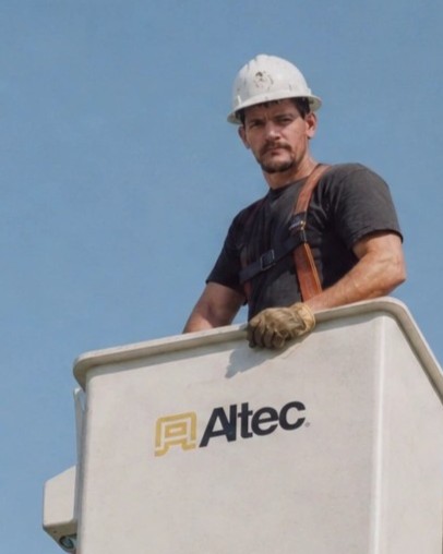 Harry Doyle doing bucket truck tree work in the 2000s